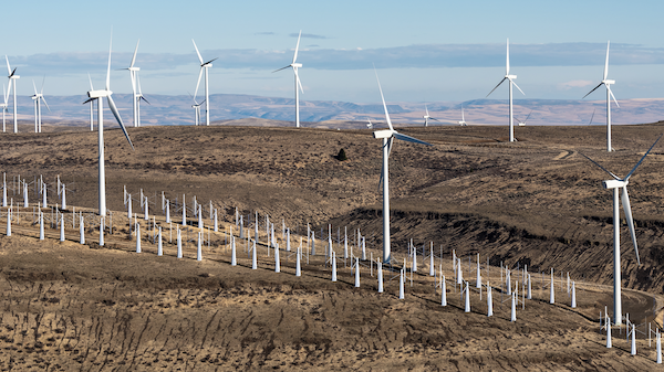 Conceptual image of a wind farm on a ridgeline showing Wind Harvest's mid-level horizontally-rotating wind turbines underneath large, vertical wind turbines.