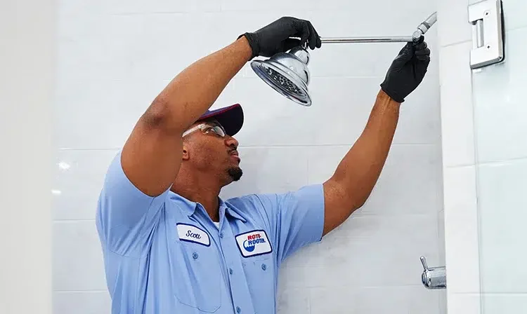 Man replacing shower head